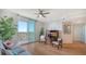 Living room with hardwood floors, a view, and comfy seating at 800 N Tamiami Trl # 403, Sarasota, FL 34236