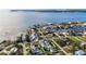 Expansive aerial view showcases waterfront homes, lush landscaping, and scenic bay views at 806 Arlington Rd, Palmetto, FL 34221