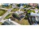 Aerial shot shows a property with a screened pool, set in a residential neighborhood at 806 Arlington Rd, Palmetto, FL 34221
