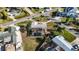 Aerial view of a home and pool, with damage to the yard, neighboring other properties at 806 Arlington Rd, Palmetto, FL 34221