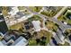 An aerial view of a home with pool, landscaping, and visible storm damage in the vicinity at 806 Arlington Rd, Palmetto, FL 34221