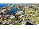 Aerial view of a waterfront home with canal access and boat slips at 806 Arlington Rd, Palmetto, FL 34221