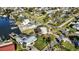 Aerial view of waterfront property with canal access and boat slips at 806 Arlington Rd, Palmetto, FL 34221