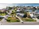 Charming waterfront home featuring a well-maintained lawn and mature palm trees, with canal access at 806 Arlington Rd, Palmetto, FL 34221