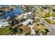 Aerial view featuring homes, lush landscaping and waterfront access, including boat docks at 806 Arlington Rd, Palmetto, FL 34221