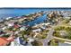 Aerial view of waterfront community with canal access, showcasing the beautiful homes and waterways at 806 Arlington Rd, Palmetto, FL 34221