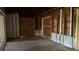 Unfinished basement featuring exposed framework with plywood and concrete block walls at 806 Arlington Rd, Palmetto, FL 34221