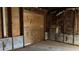 Unfinished basement featuring exposed framework with plywood walls and insulation at 806 Arlington Rd, Palmetto, FL 34221