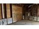 Unfinished basement featuring exposed framework with plywood walls and insulation at 806 Arlington Rd, Palmetto, FL 34221