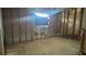 Interior view of the bathroom showcasing exposed framing, plumbing, and reno potential at 806 Arlington Rd, Palmetto, FL 34221