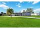 One-story home with attached garage and large front yard at 806 Arlington Rd, Palmetto, FL 34221