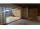 Wide-open living room featuring sliding glass doors and exposed beams at 806 Arlington Rd, Palmetto, FL 34221