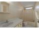 Simple bathroom with a single vanity, toilet, and a shower/tub combo at 8411 Regal Way, Palmetto, FL 34221