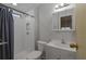Modern bathroom with white subway tile, updated fixtures, and a standalone vanity at 8411 Regal Way, Palmetto, FL 34221