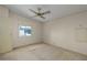 Spacious bedroom with carpeting, ceiling fan, and large window at 8411 Regal Way, Palmetto, FL 34221