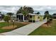 Inviting exterior with beautiful landscaping and a well-kept lawn at 8411 Regal Way, Palmetto, FL 34221