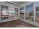 Enclosed porch with large windows offering ample natural light and views at 8411 Regal Way, Palmetto, FL 34221