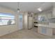 Kitchen with ample counter space and a pass-through window to the dining area at 8411 Regal Way, Palmetto, FL 34221