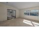 Bright living room with sliding glass doors leading to enclosed porch at 8411 Regal Way, Palmetto, FL 34221