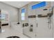 Large bathroom with a walk-in shower, soaking tub, and plenty of natural light at 8921 Artisan Way, Sarasota, FL 34240