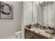 Stylish powder room with granite countertop and modern fixtures at 8921 Artisan Way, Sarasota, FL 34240