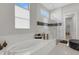 Spa-like bathroom with soaking tub and glass shower at 8921 Artisan Way, Sarasota, FL 34240