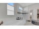 Spa-like bathroom with soaking tub and glass shower at 8921 Artisan Way, Sarasota, FL 34240