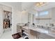 Double vanity bathroom with walk-in closet at 8921 Artisan Way, Sarasota, FL 34240