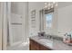 Clean bathroom with granite countertop and shower at 8921 Artisan Way, Sarasota, FL 34240