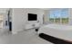 Primary bedroom with large window and views of the water at 8921 Artisan Way, Sarasota, FL 34240