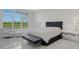 Spacious bedroom with large window and luxurious bedding at 8921 Artisan Way, Sarasota, FL 34240