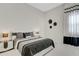 Comfortable guest bedroom with a queen-size bed and neutral decor at 8921 Artisan Way, Sarasota, FL 34240
