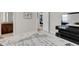 Bedroom with modern dresser and ensuite bath at 8921 Artisan Way, Sarasota, FL 34240