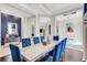 Elegant dining room with a statement wall and modern chandelier at 8921 Artisan Way, Sarasota, FL 34240
