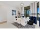 Bright dining room with a large window and modern table at 8921 Artisan Way, Sarasota, FL 34240