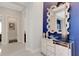 Stylish entryway featuring a large mirror and decorative accents at 8921 Artisan Way, Sarasota, FL 34240