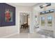 Bright entryway with view into home office and double doors at 8921 Artisan Way, Sarasota, FL 34240