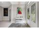 Spacious entryway showcasing stylish decor and hardwood floors at 8921 Artisan Way, Sarasota, FL 34240
