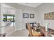 Bright home office features built-in desk and view into the living room at 8921 Artisan Way, Sarasota, FL 34240