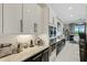 Modern kitchen with stainless steel appliances and granite countertops at 8921 Artisan Way, Sarasota, FL 34240