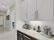 Modern kitchen with stainless steel appliances and granite countertops at 8921 Artisan Way, Sarasota, FL 34240