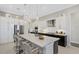 Modern kitchen with an island and breakfast bar seating at 8921 Artisan Way, Sarasota, FL 34240