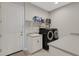 Laundry room with washer, dryer and shelving at 8921 Artisan Way, Sarasota, FL 34240
