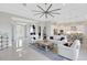 Open concept living room with kitchen and dining area visible at 8921 Artisan Way, Sarasota, FL 34240