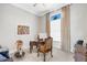 Bright home office featuring a large desk and comfortable chair at 8921 Artisan Way, Sarasota, FL 34240