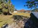 View of the fenced backyard and the back of the home at 779 Nectar Rd, Venice, FL 34293