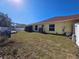 Spacious backyard with a grassy area and storage shed at 779 Nectar Rd, Venice, FL 34293
