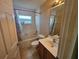 Clean and functional bathroom with a shower-tub combo at 779 Nectar Rd, Venice, FL 34293