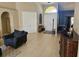 Welcoming foyer with tile flooring, double doors, and access to the dining and living areas at 779 Nectar Rd, Venice, FL 34293