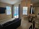 Gathering room with a TV, sliding glass doors to the backyard pool, and a breakfast nook at 779 Nectar Rd, Venice, FL 34293
